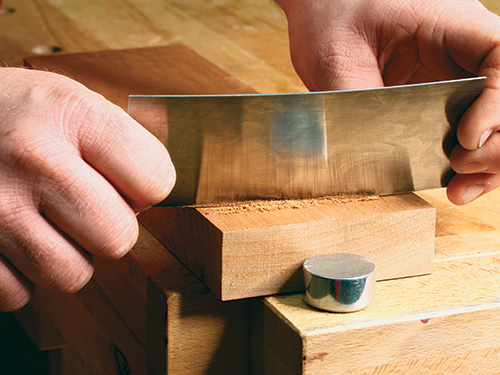 Smoothing lumber with a card scraper