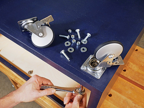Attaching caster wheels to the base of coffee table