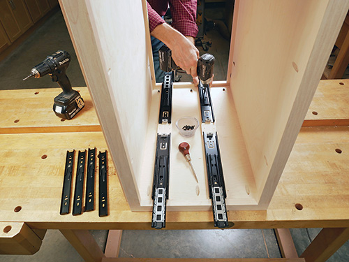 Drilling holes for installing full extension drawer slides