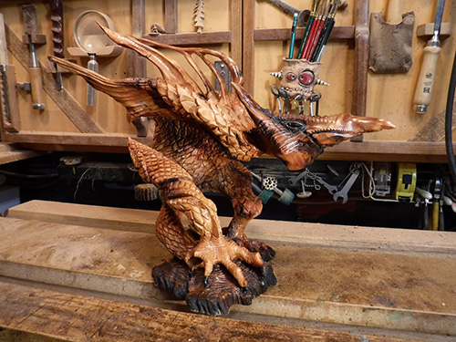 Gryphon statue carved from driftwood