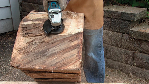 Close-up on cutting cottonwood table sides with arbortech tool