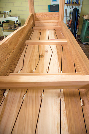 Installing spacers into the base of cedar benchtop