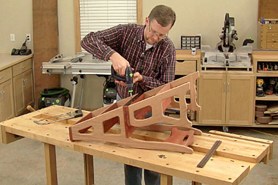 Figure 16: Cut a piece of piano hinge to length, and fasten it to the second step and seat pieces to join the upper and lower assemblies.