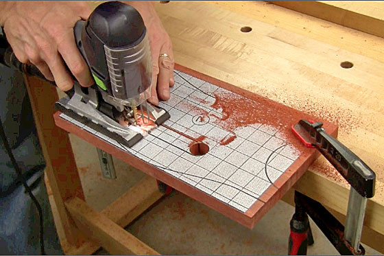Figure 9: Drill the ends of the handle cutout on the chair back so they're round, then trim away the waste in between with a jigsaw.