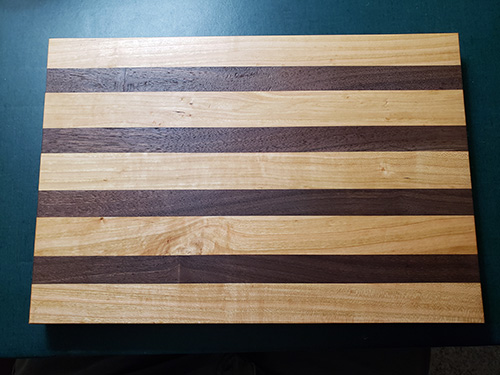 Cutting board made from cherry and walnut wood