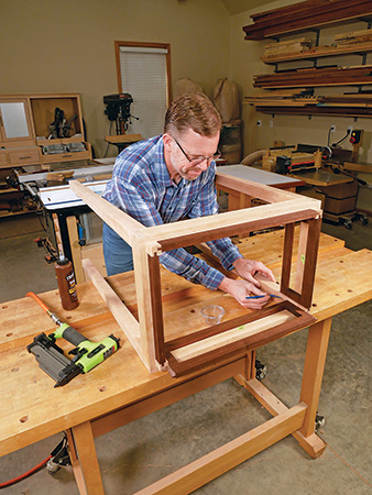 Gluing up interior portions of cabinet leg framework