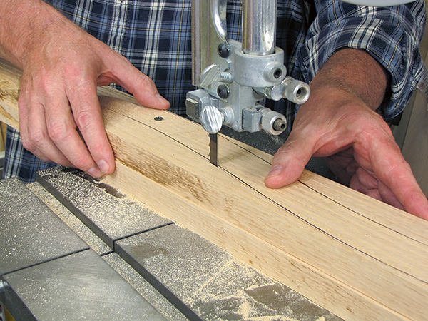 Cutting parts of chair to size with band saw