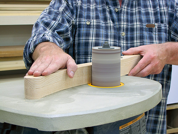 Sanding curves in chair parts with spindle sander