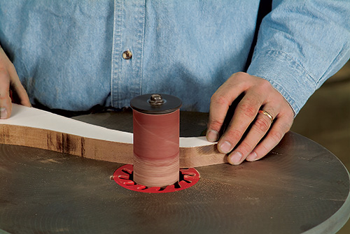 Smoothing Coat hanger legs with spindle sander