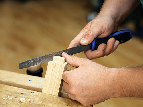 Smoothing tenon edges with rasp