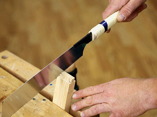 Trimming plant stand leg tenon with hand saw