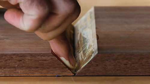 Applying glue to both sides of a joint before folding