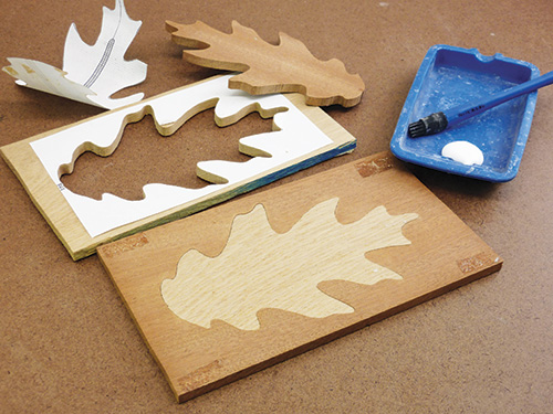 Gluing inlay into scroll sawn cut-out