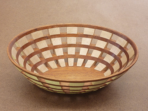 Wide open segment angled bowl made by scroll sawing and gluing