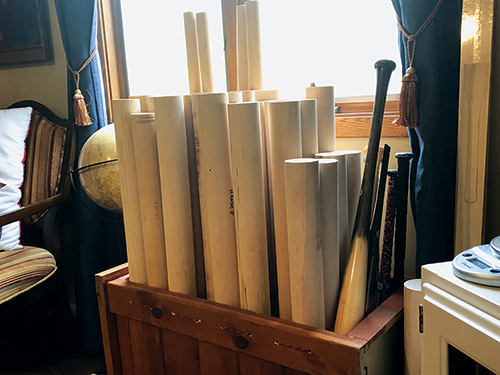 Bin of baseball bat blanks and turned bats