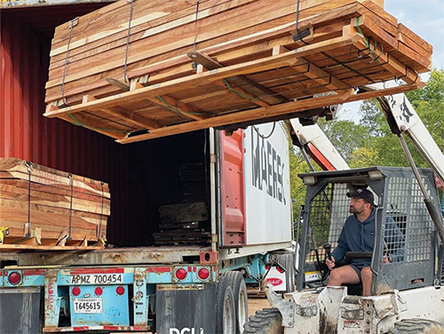 Loading milled lumber onto a box truck
