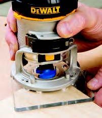 DeWALT’s fixed base option for this router, has a square see-through plastic baseplate.