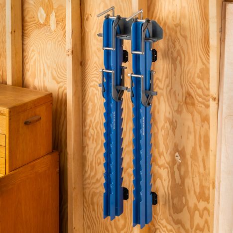Hanging panel clamps on workshop wall