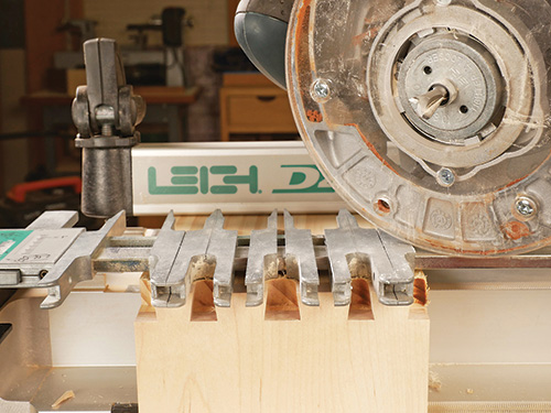 Tails routed by using an adjustable dovetail jig