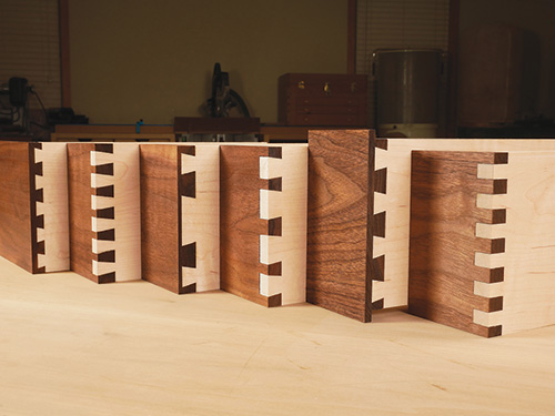 Multiple sizes of dovetails cut by a jig