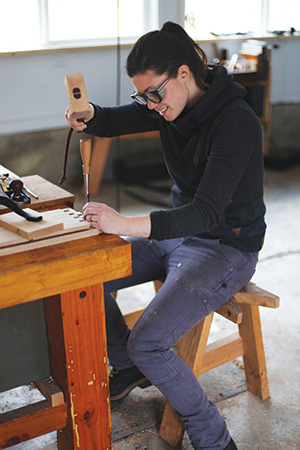 Chiseling out dovetail shoulders in whiskey cabinet