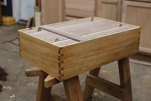 Spacing gaps in back slats of dovetailed whiskey cabinet 