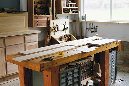 Cut, laid out alder boards for dovetailed whiskey cabinet project