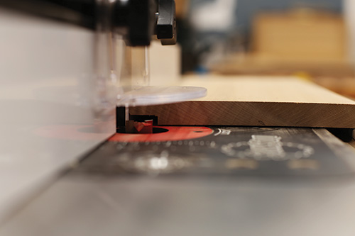 Cutting back rabbet for dovetailed whiskey cabinet at the router table