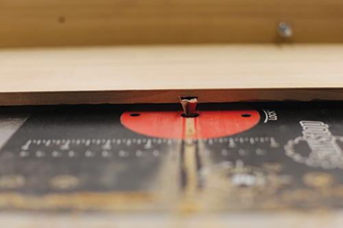 Closeup of dovetail routing on dovetailed whiskey cabinet