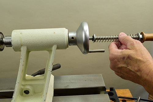 Attaching spring loaded drawbar to lathe
