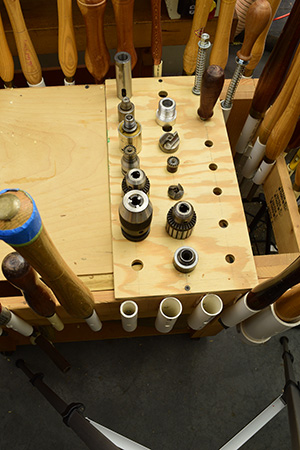 Lathe chucks stored in wooden rack