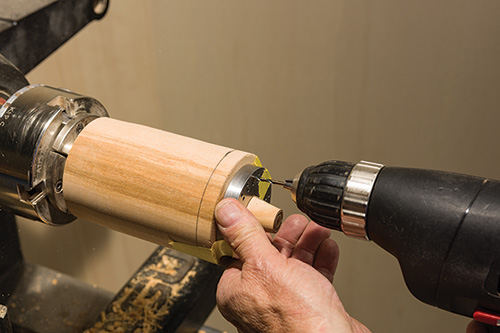 Drilling out earring holes in earring stand platform