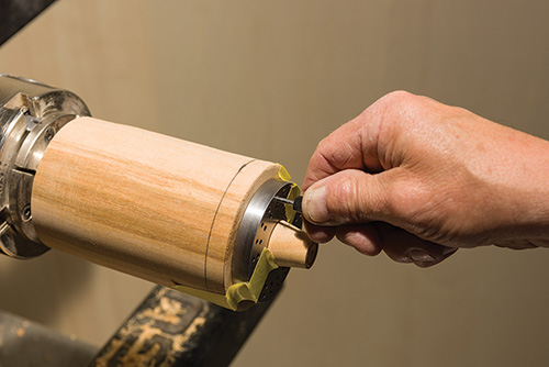 Inserting indexing pin into earring stand jig