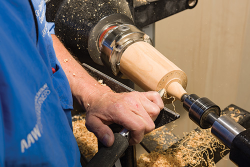 Turning the top portion of earring carrier