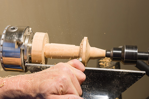 Forming the bottom portion of the earring carrier