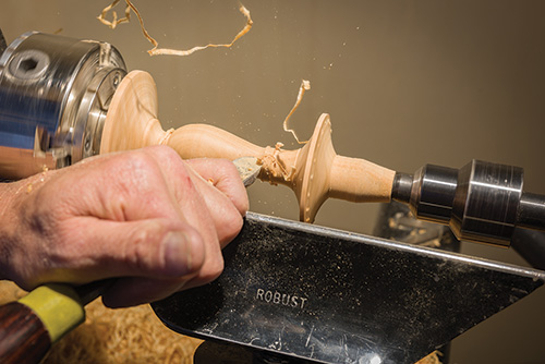 Forming the details between earring stand base and carrier