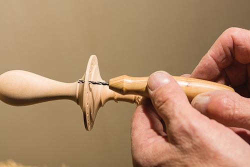 Clearing earring hole scrap with a drill bit