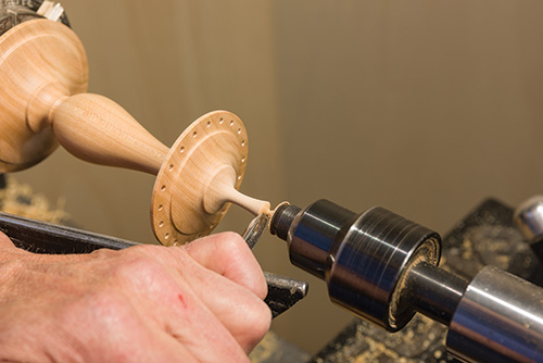 Turning a finial with gouge for earring stand