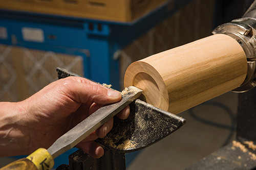 Finishing earring stand base cut with a scraper