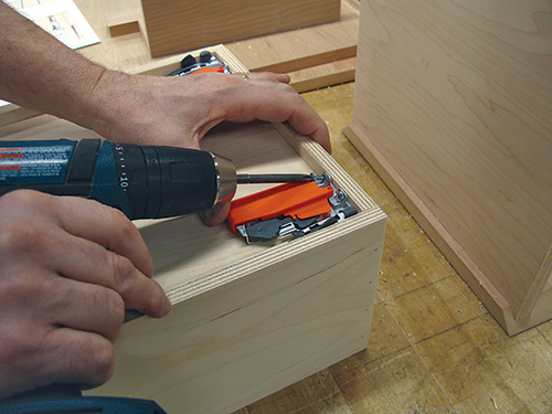 Attaching drawer locking device to entry bench drawer