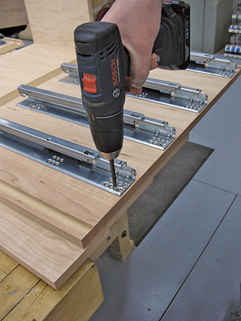 Screwing drawer slides into entry bench carcass