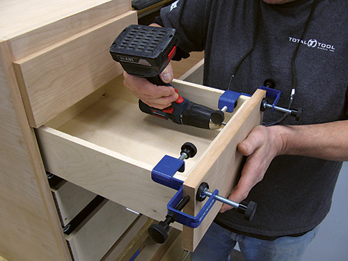 Clamped drawer screwed into place