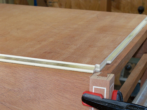 Marking out corner notches on envelope table assembly