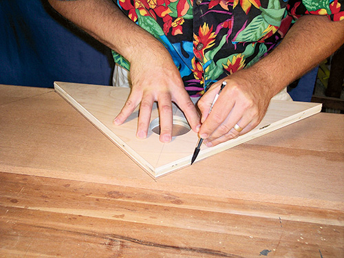 Hand marking envelope table leaves with a knife