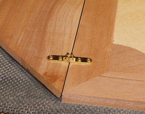 Laying out hinges before installation on envelope table