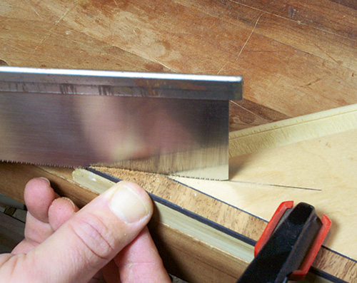 Cutting inlay strips for envelope table with hand saw