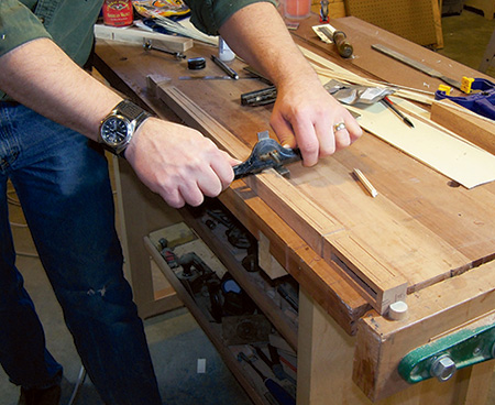 Cutting grooves with hand beader in envelope table legs