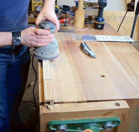 Random orbit sanding stringing into envelope table leg