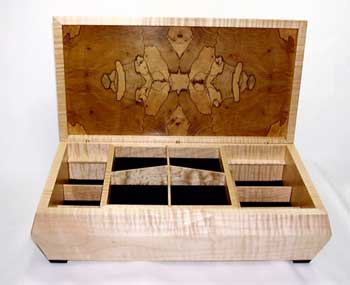 The Ink Blot Box was made with curly maple and book-matched spalted maple to look like Rorschach's famous psychology test. With the different woods expanding and contracting differently and unpredictably absorbing the finish, the piece turned into real learning experience for Eugene.
