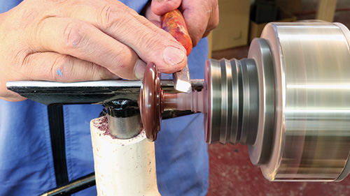 Cutting spinning top stem with skew chisel